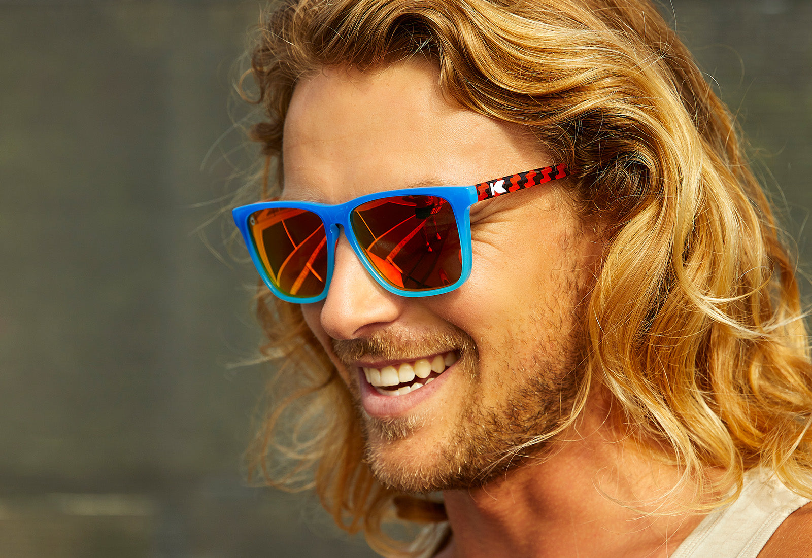 Sunglasses with Blue Frames and Polarized Red Lenses, Model