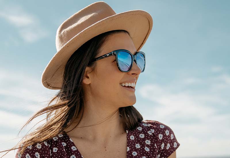 Sunglasses with Indigo Ink Frames and Polarized Snow Opal Lenses, Model