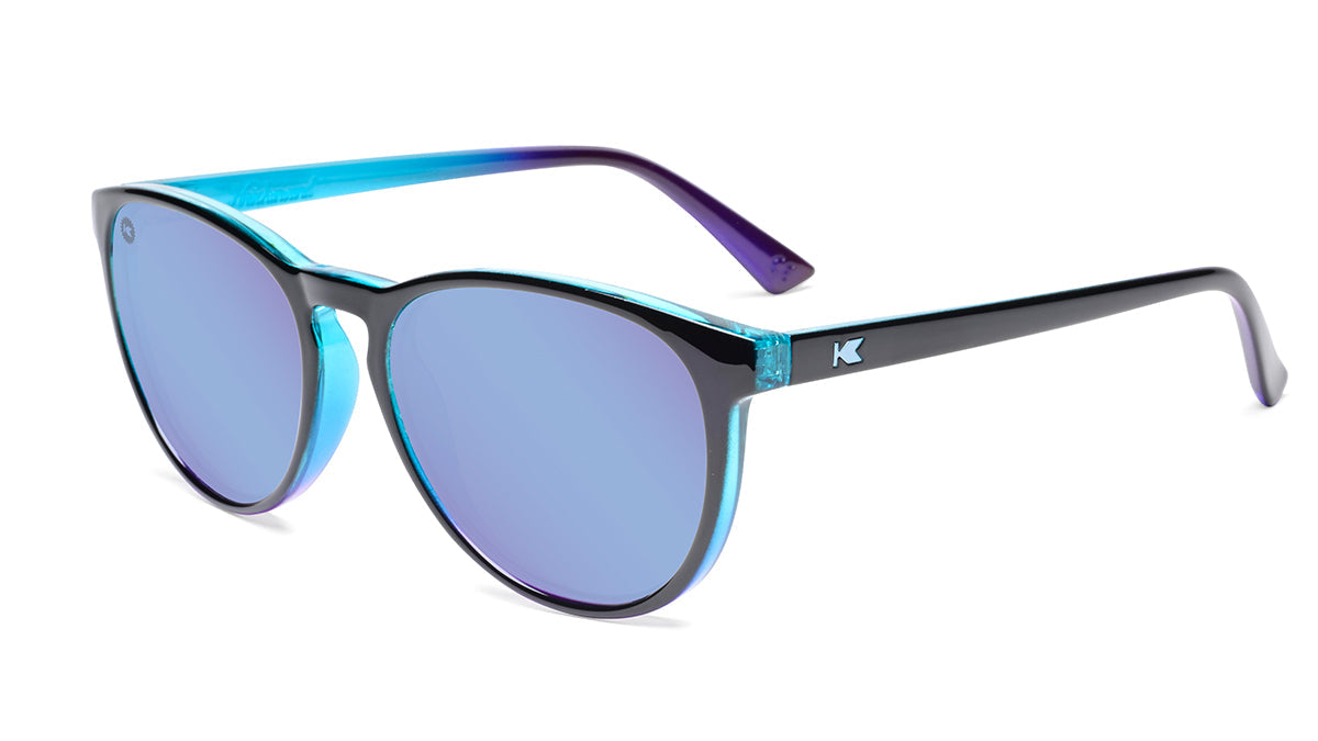 Sunglasses with Glossy Black Exterior and Ice Blue to Lavender Interior and Polarized Snow Opal Lenses. Flyover