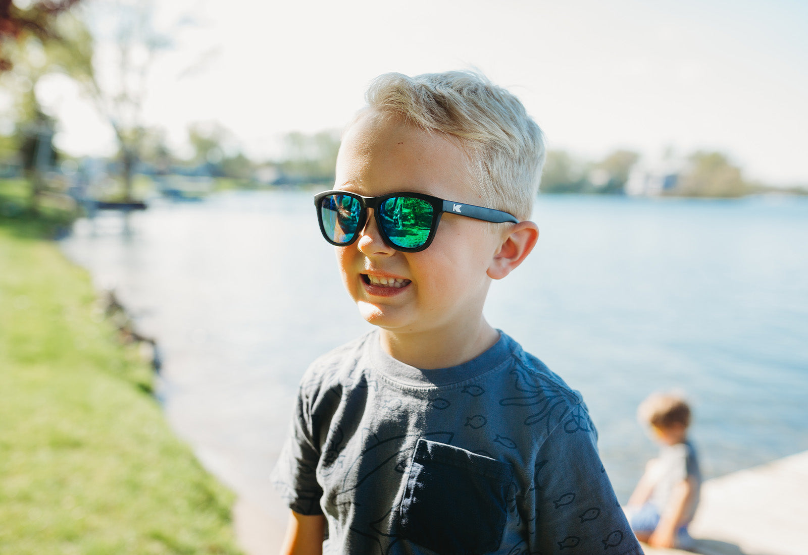 A boy kid wearing sunglasses